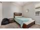 Cozy bedroom featuring a full-sized bed and carpeted floors at 22922 E Mayberry Rd, Queen Creek, AZ 85142