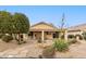 Backyard with covered patio, desert landscaping, and stone pathway at 23187 W Lasso Ln, Buckeye, AZ 85326