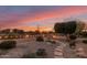 Landscaped backyard with firepit and seating area at 23187 W Lasso Ln, Buckeye, AZ 85326