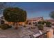 Spacious backyard with stone pathway and desert landscaping at 23187 W Lasso Ln, Buckeye, AZ 85326