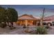 Landscaped backyard with patio and fire pit at 23187 W Lasso Ln, Buckeye, AZ 85326