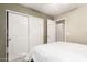 Bedroom with sliding door closet and access to bathroom at 23187 W Lasso Ln, Buckeye, AZ 85326