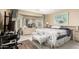 Spacious bedroom with a large bed and window seating at 23187 W Lasso Ln, Buckeye, AZ 85326