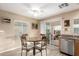 Small dining area with table and chairs near kitchen at 23187 W Lasso Ln, Buckeye, AZ 85326