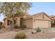 Single story home with two car garage and desert landscaping at 23187 W Lasso Ln, Buckeye, AZ 85326