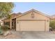 Single story home with two car garage and desert landscaping at 23187 W Lasso Ln, Buckeye, AZ 85326