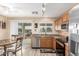 Bright kitchen with stainless steel appliances and wood cabinets at 23187 W Lasso Ln, Buckeye, AZ 85326