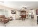 Living room with comfortable seating, a coffee table, and decorative accents at 23187 W Lasso Ln, Buckeye, AZ 85326