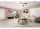 Living room with neutral decor, comfortable seating, and a large window at 23187 W Lasso Ln, Buckeye, AZ 85326