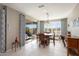 Bright dining room with patio access and wood table at 26467 W Zachary Dr, Buckeye, AZ 85396