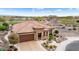 Single-story home with tile roof and nicely landscaped yard; golf course view at 26702 W Sierra Pinta Dr, Buckeye, AZ 85396