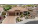 Single-story home with tile roof and nicely landscaped yard; golf course view at 26702 W Sierra Pinta Dr, Buckeye, AZ 85396