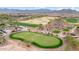 Aerial view of a community golf course and homes at 26702 W Sierra Pinta Dr, Buckeye, AZ 85396