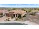 Single-story home with tile roof and nicely landscaped yard; golf course view at 26702 W Sierra Pinta Dr, Buckeye, AZ 85396