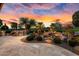 Outdoor kitchen, water feature, and expansive patio create a relaxing backyard retreat at 26702 W Sierra Pinta Dr, Buckeye, AZ 85396