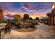 Stunning backyard with a water feature, fire pit, and built-in BBQ at 26702 W Sierra Pinta Dr, Buckeye, AZ 85396