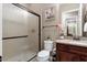 Bathroom with shower, toilet, vanity, and granite countertop at 26702 W Sierra Pinta Dr, Buckeye, AZ 85396
