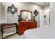 Bedroom with dresser, mirror, and window shutters at 26702 W Sierra Pinta Dr, Buckeye, AZ 85396