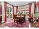 Bright dining room with hardwood floors and access to a patio at 26702 W Sierra Pinta Dr, Buckeye, AZ 85396