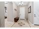 Bright entryway with tile floors and a wooden bench at 26702 W Sierra Pinta Dr, Buckeye, AZ 85396