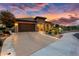 Single-story home with stone accents and beautifully landscaped front yard at 26702 W Sierra Pinta Dr, Buckeye, AZ 85396