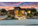 Single-story home with stone accents and beautifully landscaped front yard at 26702 W Sierra Pinta Dr, Buckeye, AZ 85396