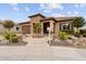 House exterior with stone accents and a circular driveway at 26702 W Sierra Pinta Dr, Buckeye, AZ 85396