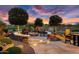 Cozy fire pit area with seating and beautiful sunset views at 26702 W Sierra Pinta Dr, Buckeye, AZ 85396