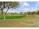 Picture of a manicured golf course with a green and sand trap at 26702 W Sierra Pinta Dr, Buckeye, AZ 85396