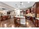 Gourmet kitchen with island, stainless steel appliances, and rich wood cabinetry at 26702 W Sierra Pinta Dr, Buckeye, AZ 85396