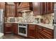 Modern kitchen featuring stainless steel appliances and custom cabinetry at 26702 W Sierra Pinta Dr, Buckeye, AZ 85396
