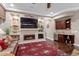 Living room with a wet bar and built-in shelving at 26702 W Sierra Pinta Dr, Buckeye, AZ 85396