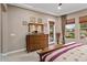 Main bedroom with dresser and access to a private balcony at 26702 W Sierra Pinta Dr, Buckeye, AZ 85396