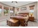Spacious main bedroom with ample natural light and wood furniture at 26702 W Sierra Pinta Dr, Buckeye, AZ 85396