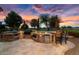 Luxury outdoor kitchen with grill, refrigerator, and ample counter space at 26702 W Sierra Pinta Dr, Buckeye, AZ 85396