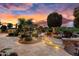 Landscaped patio with fire pit and seating area at 26702 W Sierra Pinta Dr, Buckeye, AZ 85396