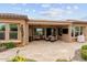 Covered patio with seating and outdoor TV at 26702 W Sierra Pinta Dr, Buckeye, AZ 85396