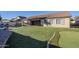 Spacious backyard oasis featuring a pool and putting green at 3121 E Hackamore St, Mesa, AZ 85213