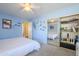 Bedroom with full-size bed and mirrored closet at 3121 E Hackamore St, Mesa, AZ 85213