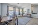 Bright dining room with large windows overlooking backyard at 3121 E Hackamore St, Mesa, AZ 85213