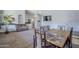 Dining area with a wooden table, seating, and a sofa at 3121 E Hackamore St, Mesa, AZ 85213