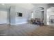 Dining room adjacent to entryway with a large TV at 3121 E Hackamore St, Mesa, AZ 85213