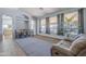 Dining area with large windows, a table and seating for six at 3121 E Hackamore St, Mesa, AZ 85213