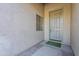Front door entry with light gray door and small window at 3121 E Hackamore St, Mesa, AZ 85213