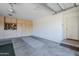 Spacious garage with ample storage cabinets and flooring at 3121 E Hackamore St, Mesa, AZ 85213