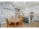 Open concept kitchen with island and view of dining area at 3121 E Hackamore St, Mesa, AZ 85213
