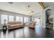 Spacious living room with dark hardwood floors and access to the backyard at 3121 E Hackamore St, Mesa, AZ 85213