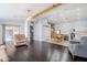 Open living area with dark hardwood floors at 3121 E Hackamore St, Mesa, AZ 85213