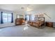 Main bedroom with carpeted floors, ceiling fan, and ensuite bathroom at 3121 E Hackamore St, Mesa, AZ 85213