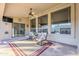 Relaxing covered patio with seating and rug at 3121 E Hackamore St, Mesa, AZ 85213